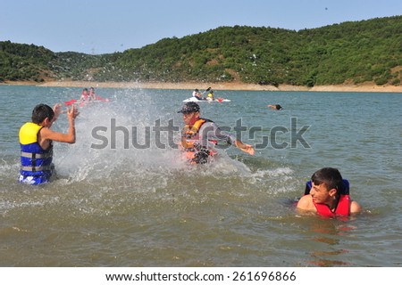 ISTANBUL ,TURKEY - JULY 14: Students taking swimming lessons at the scout camp on July 14, 2012 in Istanbul, Turkey.