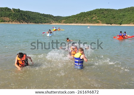 ISTANBUL ,TURKEY - JULY 14: Students taking swimming lessons at the scout camp on July 14, 2012 in Istanbul, Turkey.