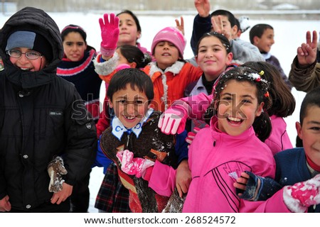 VAN, TURKEY - JAN 25: Earthquake victim children tent city. They play in the yard of the temporary school at the earthquake of Van-Ercis on January  25, 2012 in Van, Turkey.