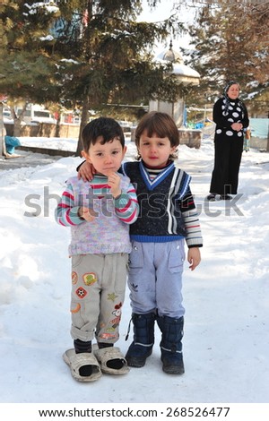 VAN, TURKEY - JAN 26: Earthquake victim children in the tent city.  at the earthquake of Van-Ercis on January  26, 2012 in Van, Turkey.