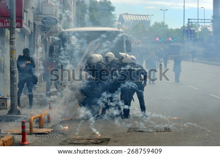 ISTANBUL - MAY 1: Many people can\'t take part in May Day march on May 1, 2014 in Istanbul. Police blocked all the ways to Taksim Square to prevent activists from joining their mates.