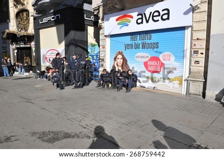 ISTANBUL - MAY 1: Many people can't take part in May Day march on May 1, 2014 in Istanbul. Police blocked all the ways to Taksim Square to prevent activists from joining their mates.