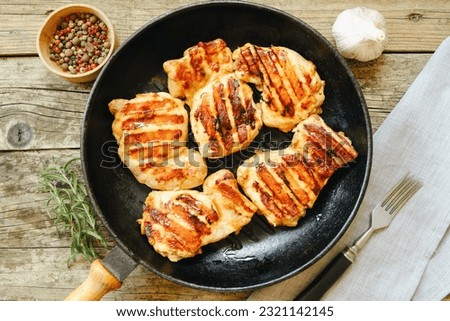 Similar – Image, Stock Photo Grill pan with rosemary and garlic in kitchen