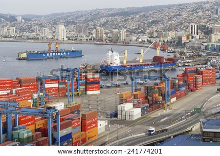 VALPARAISO, CHILE - OCTOBER 18, 2013: View to the cargo sea port and residential area of Valparaiso city on October 18, 2013 in Valparaiso, Chile. Valparaiso sea port is the busiest one in Chile.