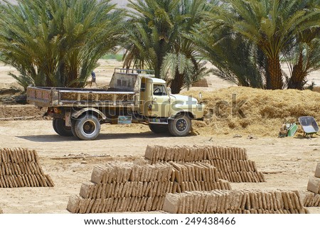 SHIBAM, YEMEN - SEPTEMBER 12, 2006: Ready to load truck parked at the mud brick factory on September 12, 2006 in Shibam, Yemen. Mud bricks is a traditional construction material in Hadramaut valley.