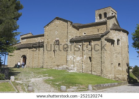 SAN LEO, ITALY - MAY 14, 2013: Unidentified people enter the medieval cathedral of San Leo on May 14, 2013 in San Leo, Italy. Cathedral of San Leo was built in 12th century.