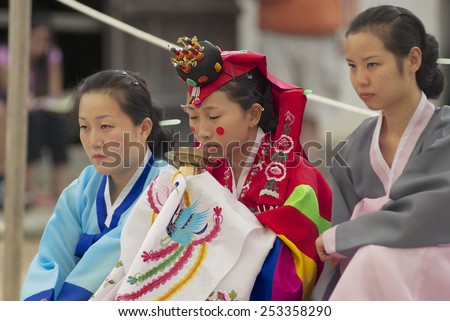 YONGIN, KOREA - SEPTEMBER 02, 2008: Unidentified women demonstrate traditional Korean wedding ceremony on September 02, 2008 in Yongin, Korea.