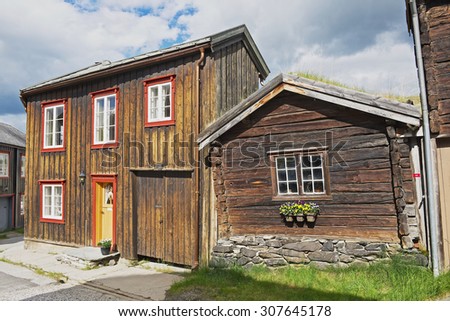 ROROS, NORWAY - JUNE 24, 2013: Exterior of the traditional timber houses of the copper mines town of Roros, Norway. Roros town is declared a UNESCO World Heritage site.