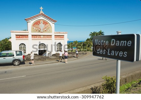 SAINTE-ROSE DE LA REUNION, FRANCE - DECEMBER 06, 2010: Unidentified people explore the Notre dame des laves church in Sainte-Rose De La Reunion, France.
