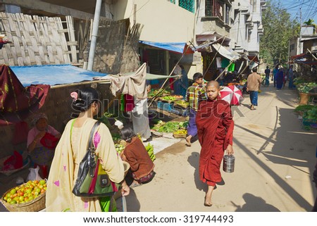 BANDARBAN, BANGLADESH - FEBRUARY 20, 2014: Unidentified people walk by the street in Bandarban, Bangladesh.