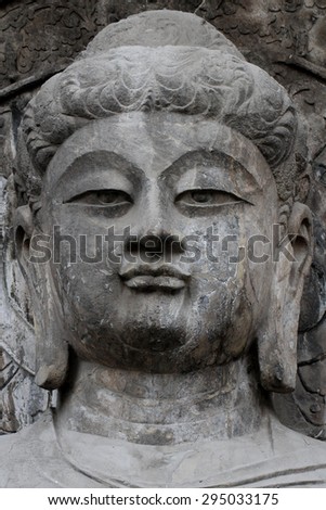 Buddha face sculpture of Long-men Grottoes in Loyang, China
