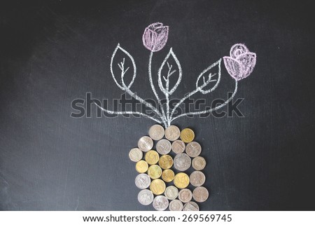 Money plant drawing with foreign currencies are on black background. Mostly are US, UK and EU currencies. This photo may use as financial background. Concept is drawing by colored chalk.