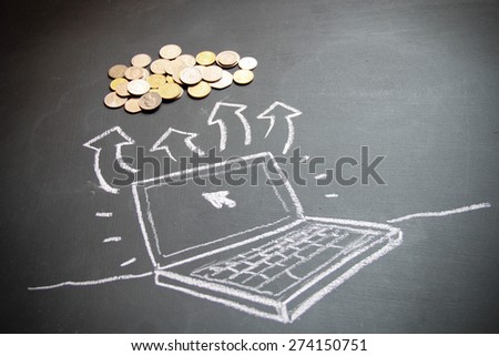 Conceptual design of laptop drawing with chalk on blackboard. Concept is money and business. Different countries currencies are here.