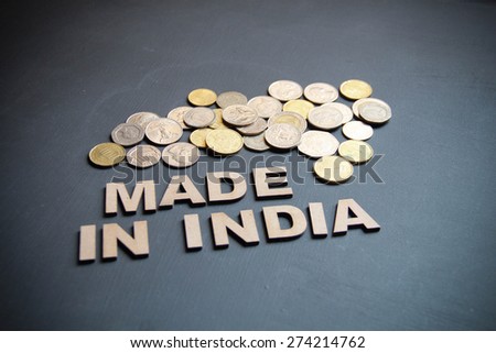 Made in India concept written with wooden letters on blackboard. Its a business concept with a studio shot.