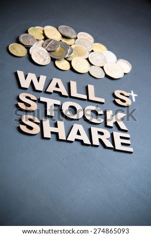 Business stock and share concept written with wooden letters on blackboard. This photo can use as Business background.