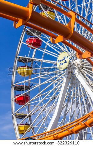 SANTA MONICA, CALIFORNIA - AUGUST 2, 2015: Pacific Park on the Santa Monica pier in Santa Monica, California. The park opened on 1996 and has the world\'s only solar powered Ferris wheel.