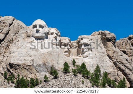 Colossal sculpture of heads of four United States Presidents, George Washington, Thomas Jefferson, Theodore Roosevelt, and Abraham Lincoln carved into the granite face of Mount Rushmore. Сток-фото © 