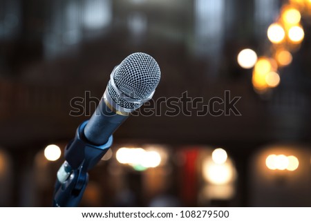 Close up of microphone in concert hall or conference room