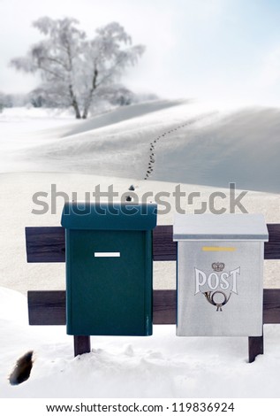 Mail boxes and footprints in snow in remote area