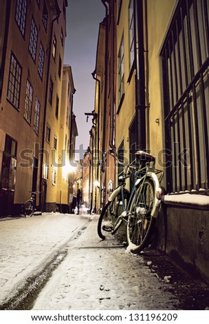Parked bicycle in narrow street in the old town of Stockholm,, vintage style