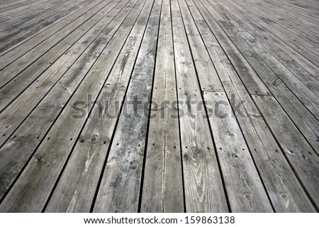 Background with weathered floor of knotted wood