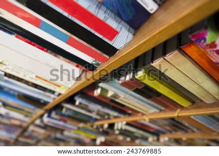close up of books in book shelf in library