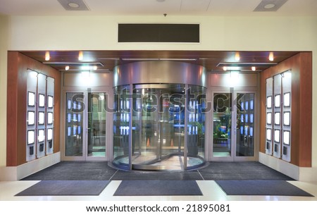 Entrance to hotel lobby with revolving door.