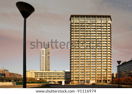 Office building in shades of gold in urban landscape
