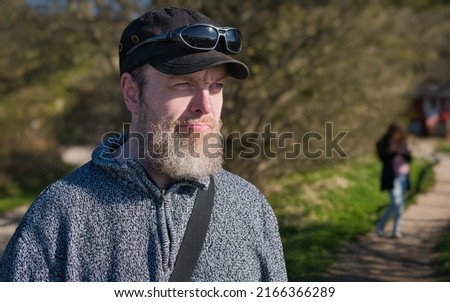 Similar – Image, Stock Photo Man stands with Frisian mink on the coast in the dunes