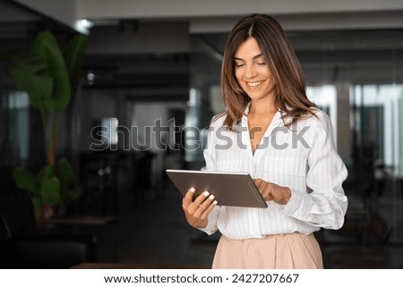 Similar – Image, Stock Photo Concerned businesswoman working on computer in office. Busy woman sitting at desk at front of computer monitor. Focusing on work. Open office. Copy space right