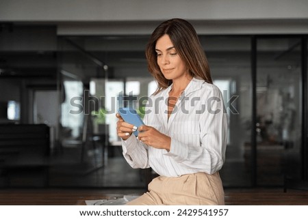 Image, Stock Photo Senior woman using mobile phone at home