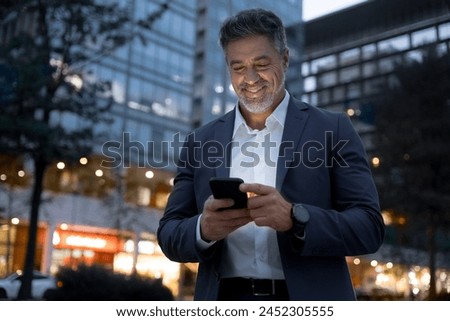 Similar – Image, Stock Photo Senior man using mobile phone on table near laptop