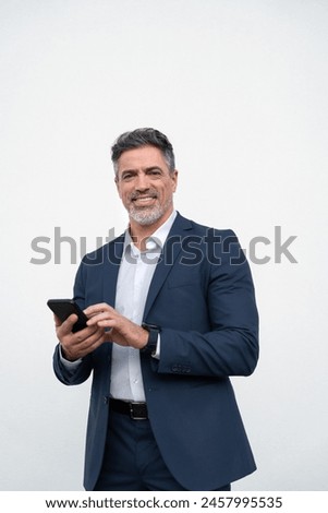 Similar – Image, Stock Photo Senior man using mobile phone on table near laptop