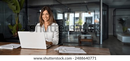 Similar – Image, Stock Photo Focused professional using app on tablet outside. Young African American business woman holding digital device, looking at screen, smiling. Online app concept, businesspeople,break from meeting