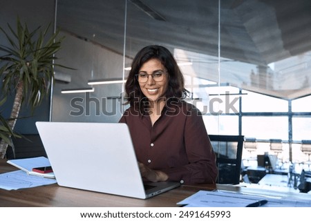 Similar – Image, Stock Photo Middle aged woman doing exercise on the beach