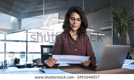 Image, Stock Photo Young busy woman reading book on rooftop