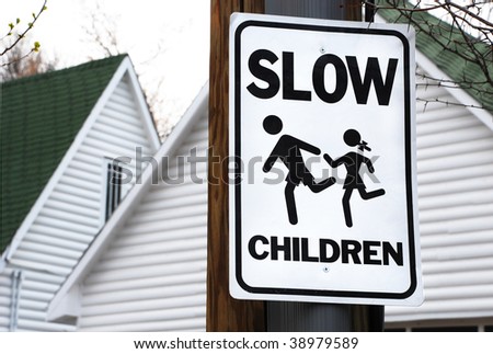 Neighborhood sign asks drivers to slow down for children