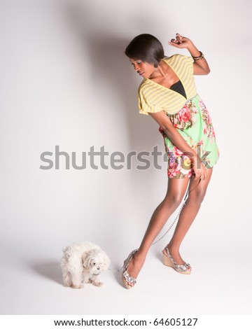 Beautiful black girl posing with a dog pinup style