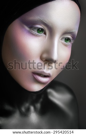 Portrait of a mysterious woman with a fantastic makeup Alien