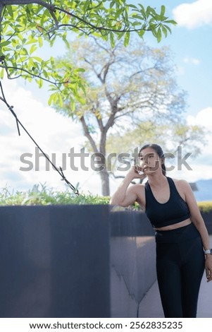 Similar – Image, Stock Photo Sportswoman leaning on wall on street and looking at camera