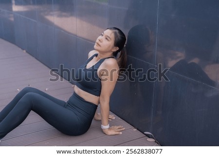 Similar – Image, Stock Photo Sportswoman leaning on wall on street and looking at camera