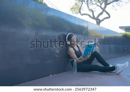 Similar – Image, Stock Photo Sportswoman leaning on wall on street and looking at camera