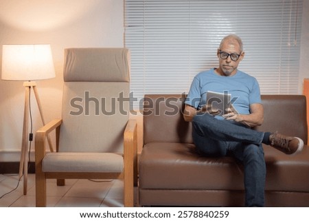 Similar – Image, Stock Photo Relaxed man reading notes in notebook