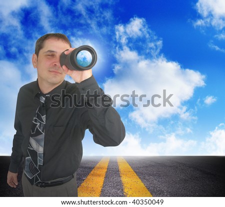 A business man is looking through binoculars. There are clouds behind him and a road. Can represent the future and planning ahead or a strategy and a discovery of an idea.
