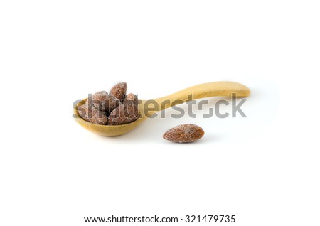 salt almond in wooden spoon (teaspoon) isolated in white background