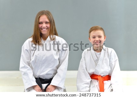 a group of young and successful karate poses with karate master