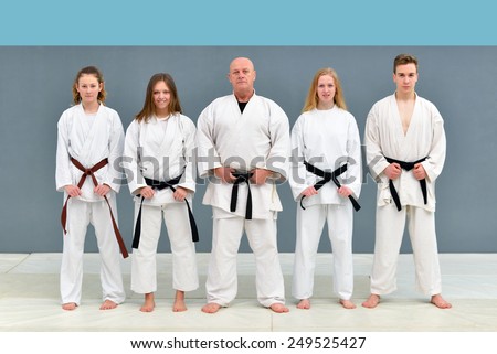 a group of young, beautiful women and men karate karate exercise positions