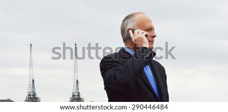 Business man on phone outside
