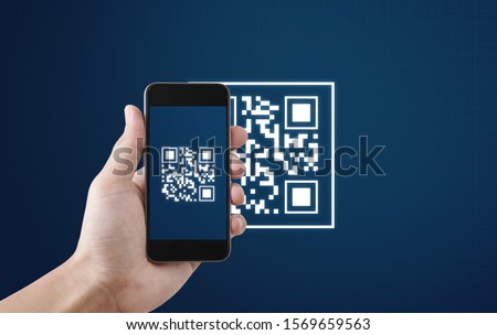 QR code scanning payment and verification. Hand using mobile smart phone scan QR code ストックフォト © 