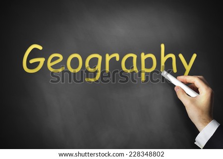hand writing geography on black chalkboard class